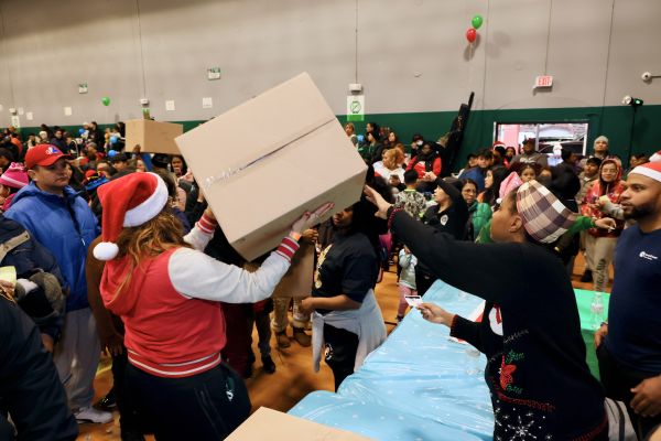 Handing out boxes at the Holiday Party